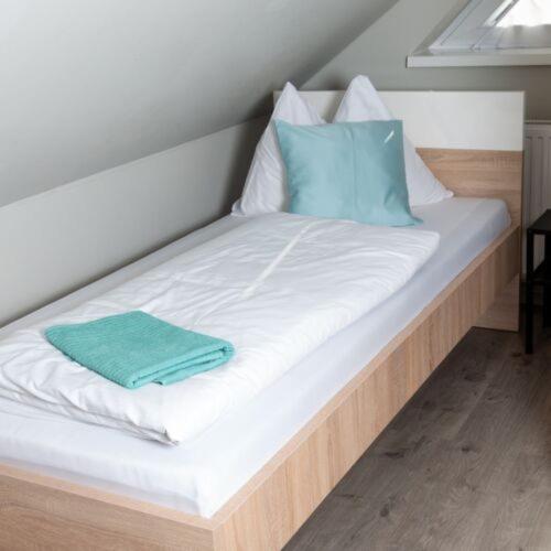 Posteľ alebo postele v izbe v ubytovaní Báró Berg Apartman