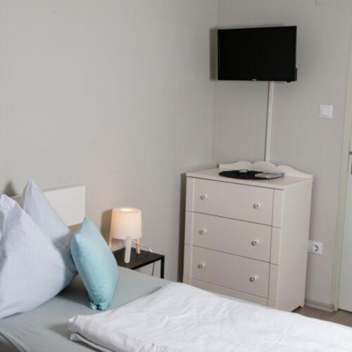 Posteľ alebo postele v izbe v ubytovaní Báró Berg Apartman