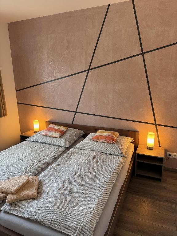 Postel nebo postele na pokoji v ubytování Apartmány Catalina