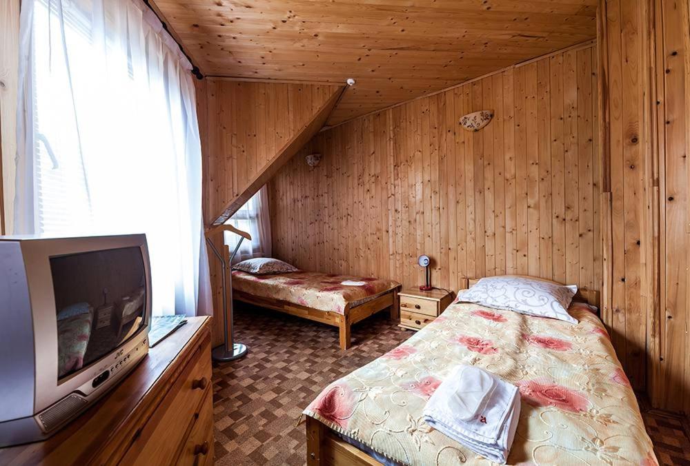 Postel nebo postele na pokoji v ubytování Готель Ольга