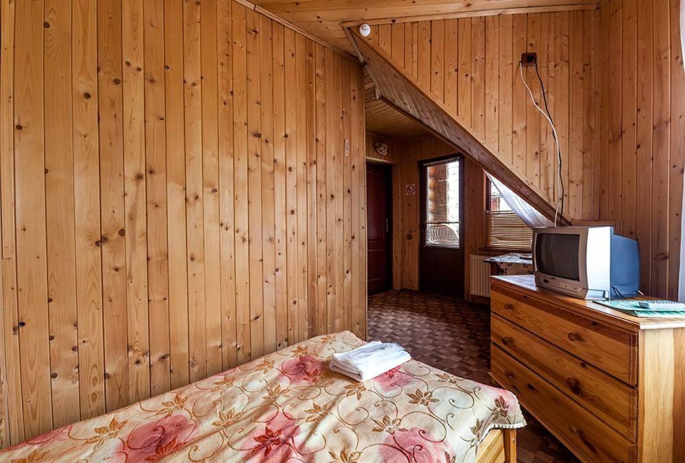 Postel nebo postele na pokoji v ubytování Готель Ольга