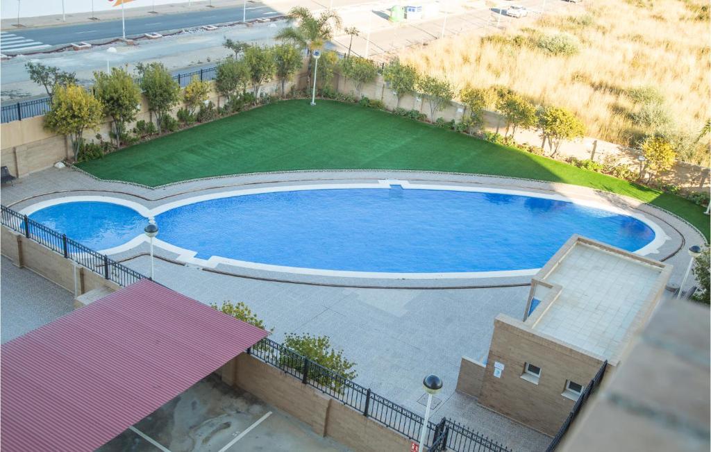 an overhead view of a swimming pool in a building at Cozy Apartment In Oropesa Del Mar in Oropesa del Mar