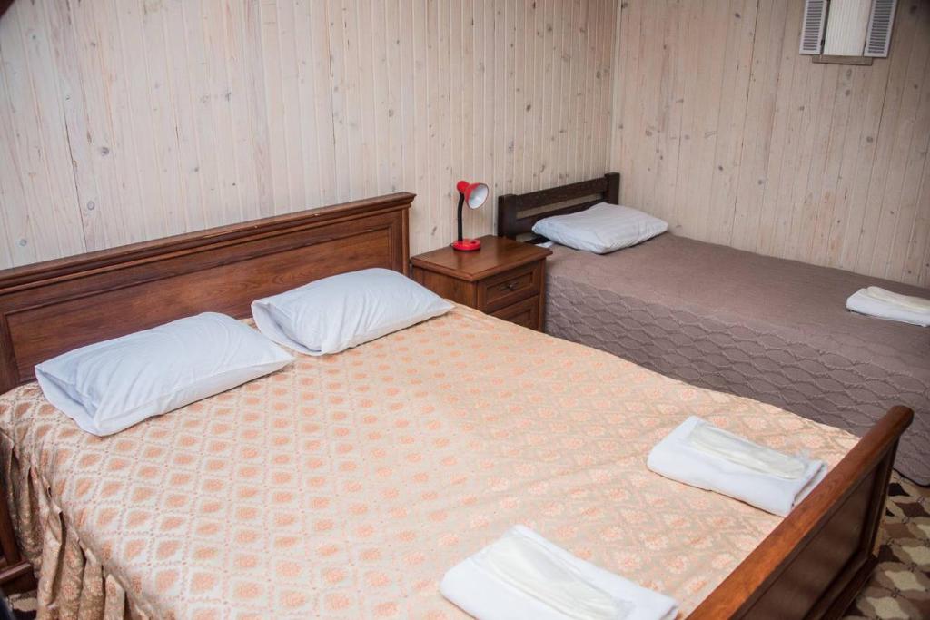 Postel nebo postele na pokoji v ubytování Готель Ольга
