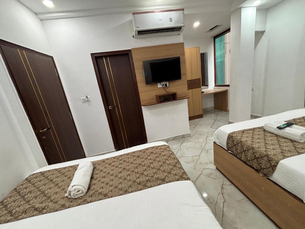 Postel nebo postele na pokoji v ubytování Hotel C & G 4 Minuit Walkable New Delhi Railway Station & 7 Minit VFS Shivaji Stadium Metro Station