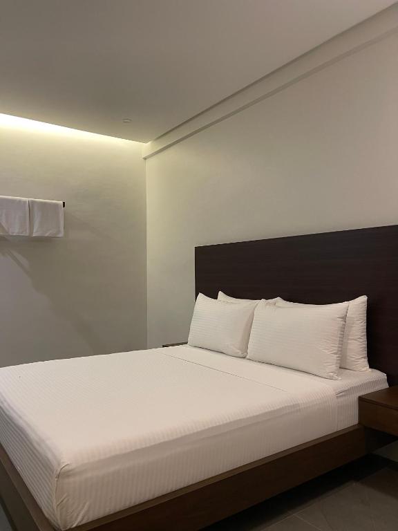 Postel nebo postele na pokoji v ubytování Joane Suites by Hotel Cara
