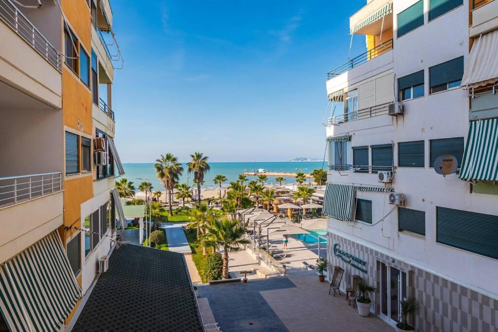 a view of the beach from the balcony of a building at The Beachfront Bliss by PS in Golem