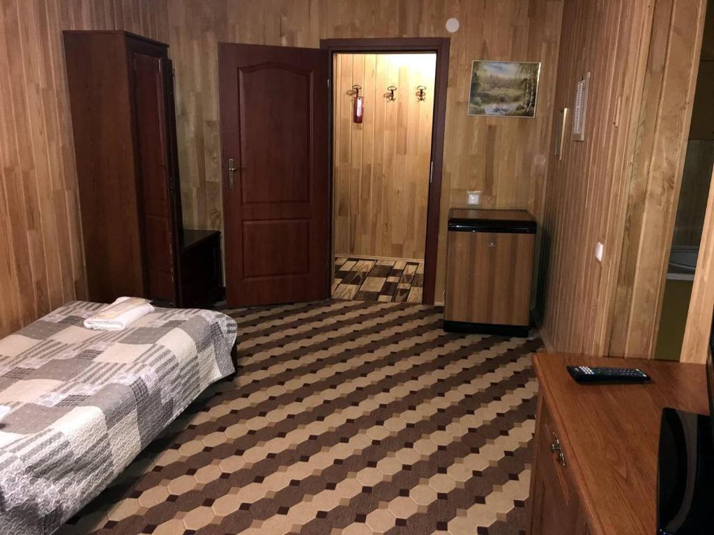 Postel nebo postele na pokoji v ubytování Готель Ольга