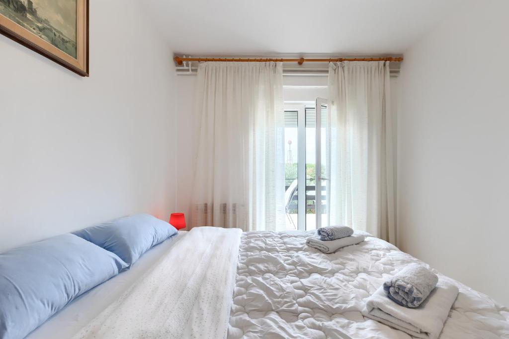 Łóżko lub łóżka w pokoju w obiekcie Apartments Erla