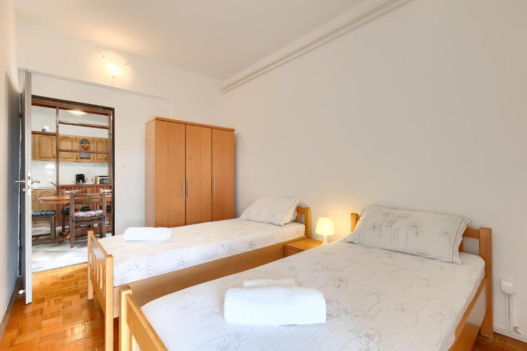 Łóżko lub łóżka w pokoju w obiekcie Apartments Erla