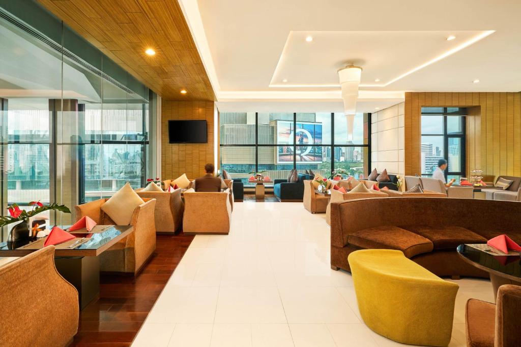 A bright lobby lounge overlooking the surrounding city.