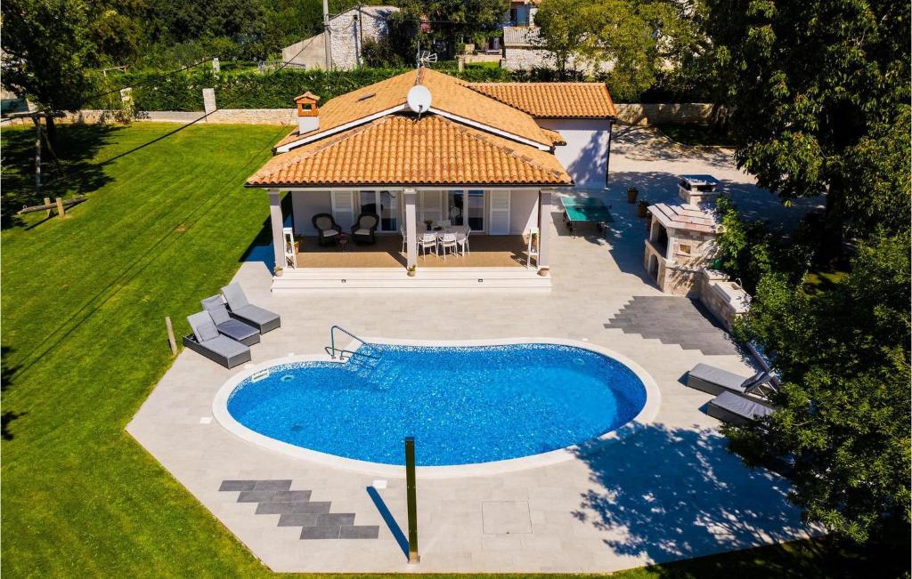 an overhead view of a swimming pool in a backyard at Villa Miana in Orbanići