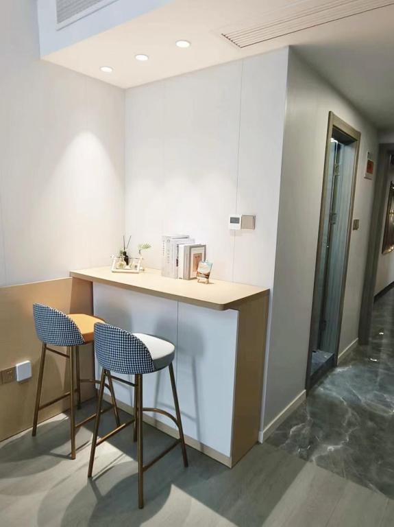 Kuchyň nebo kuchyňský kout v ubytování 彩虹小居陆家嘴店