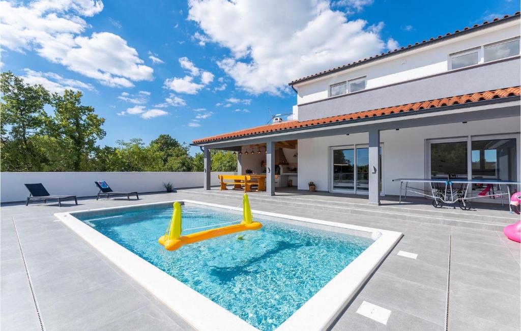 a swimming pool in the backyard of a house at Villa Casa Mara in Pula