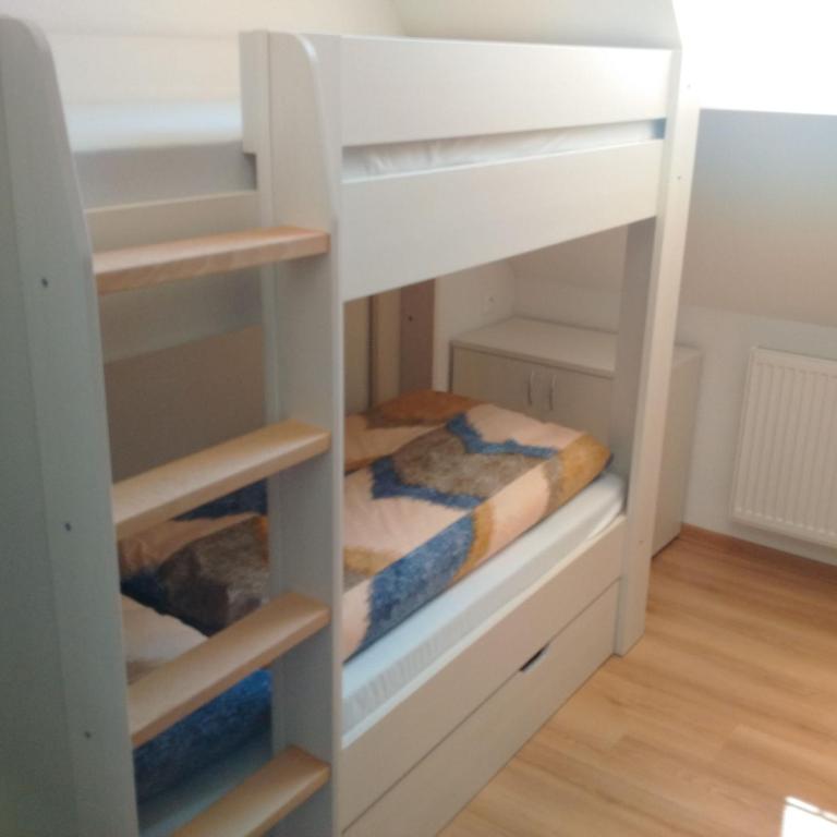 Postel nebo postele na pokoji v ubytování Hostel pod Krivanom