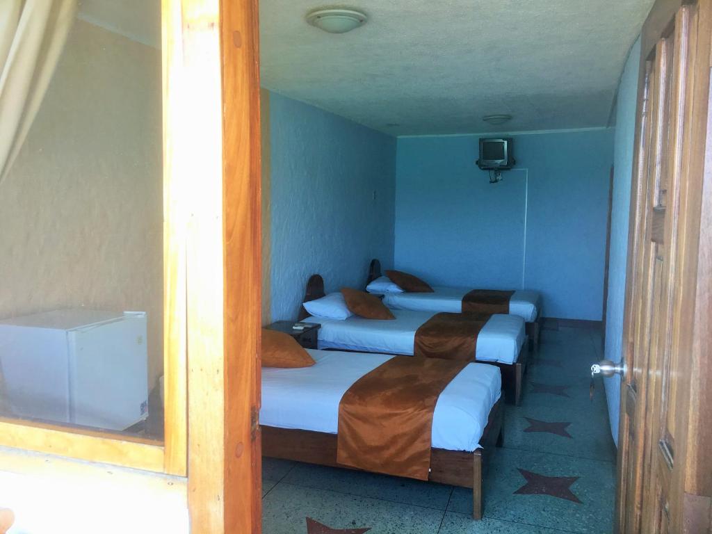 Postel nebo postele na pokoji v ubytování Hostal Estrella de Mar
