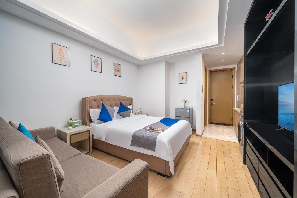 TV a/nebo společenská místnost v ubytování Hantao AI Select International Apartment