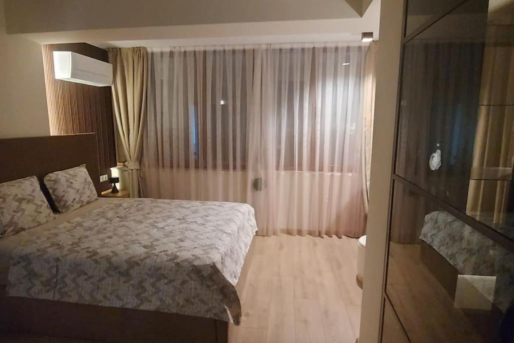 Postel nebo postele na pokoji v ubytování Екип-МГ