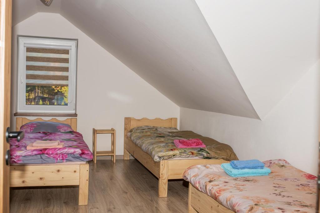 Postel nebo postele na pokoji v ubytování Pstrągowe Zacisze