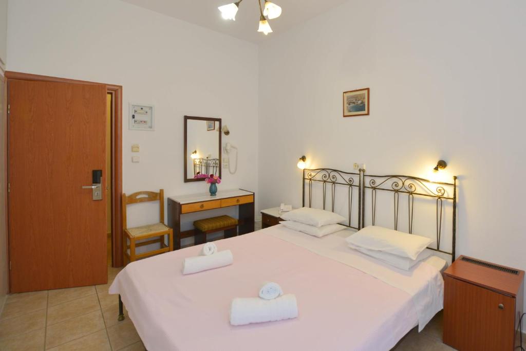 Postel nebo postele na pokoji v ubytování Artemon Hotel