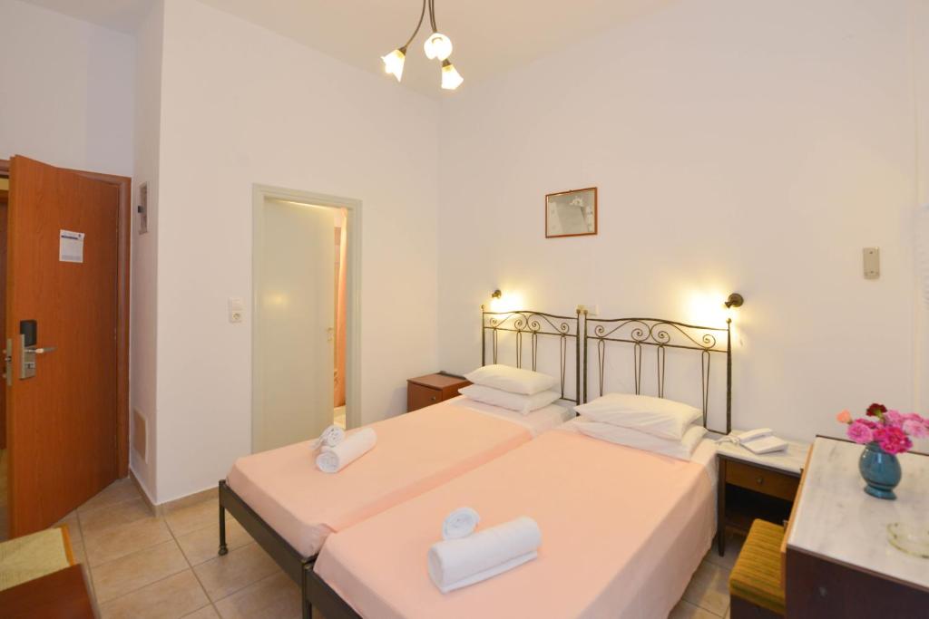 Postel nebo postele na pokoji v ubytování Artemon Hotel