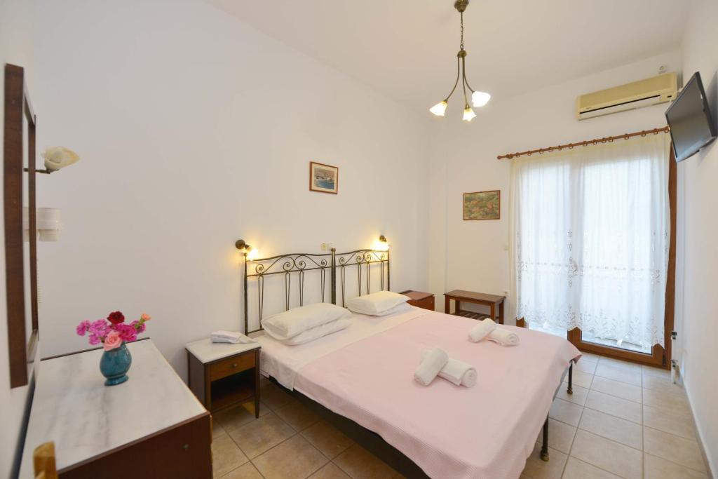 Postel nebo postele na pokoji v ubytování Artemon Hotel