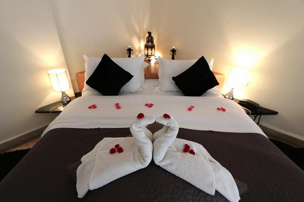 Postel nebo postele na pokoji v ubytování Riad Dar L'Oussia & SPA