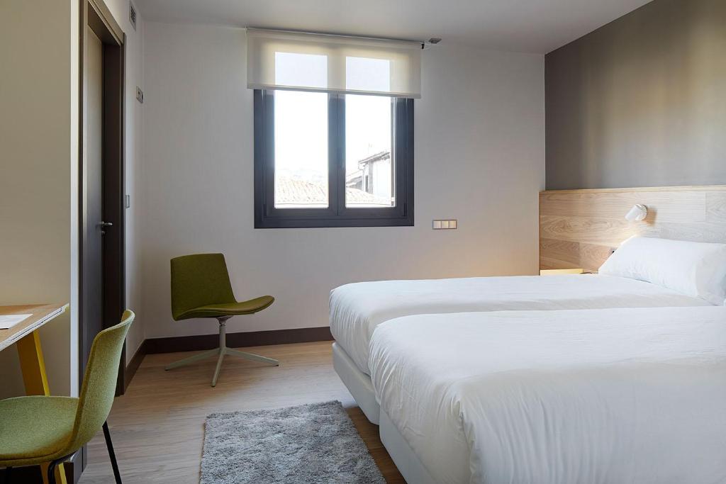 Postel nebo postele na pokoji v ubytování Hotel Imaz