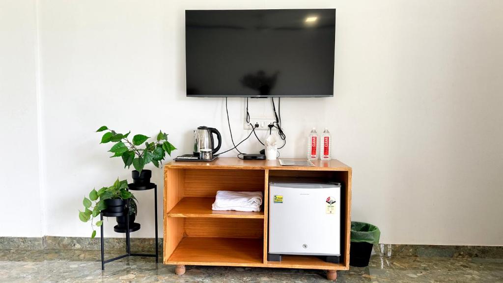 TV a/nebo společenská místnost v ubytování Kalani Farms