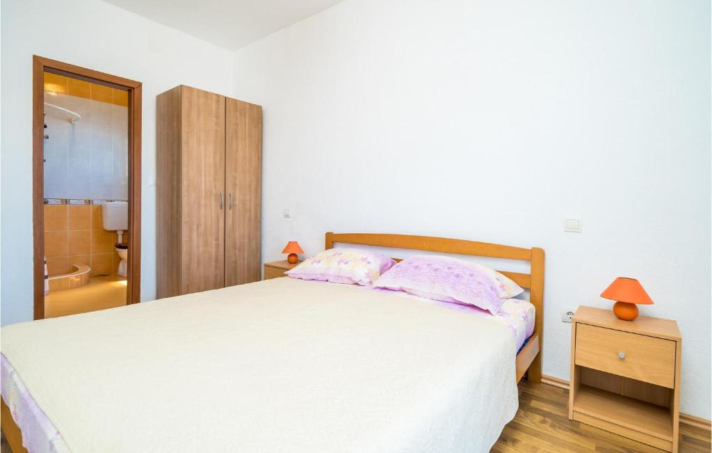 Posteľ alebo postele v izbe v ubytovaní Apartment Gruda Molunat