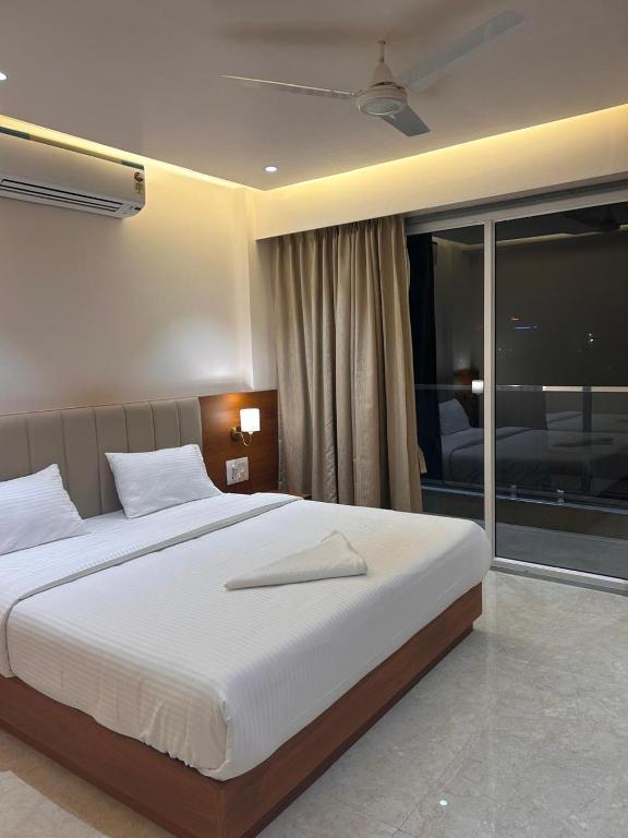 Postel nebo postele na pokoji v ubytování Hotel Neem Heritage