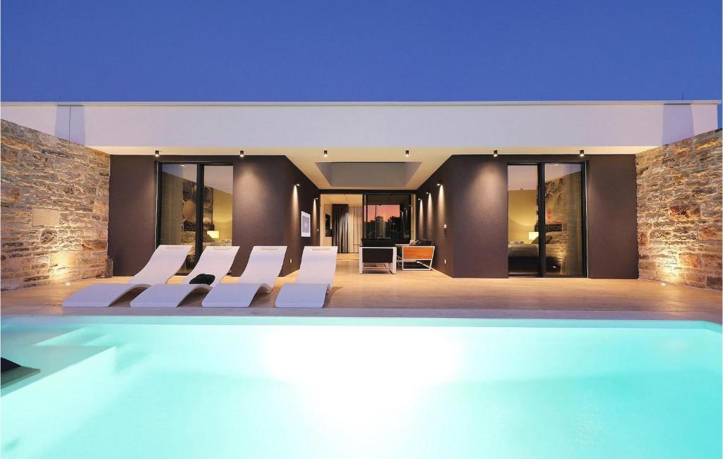 a villa with a swimming pool in a building at Villa K1 in Zadar