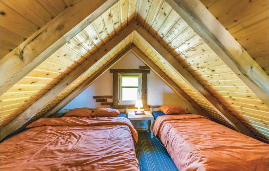 Postel nebo postele na pokoji v ubytování Studio Holiday Home In Bratina