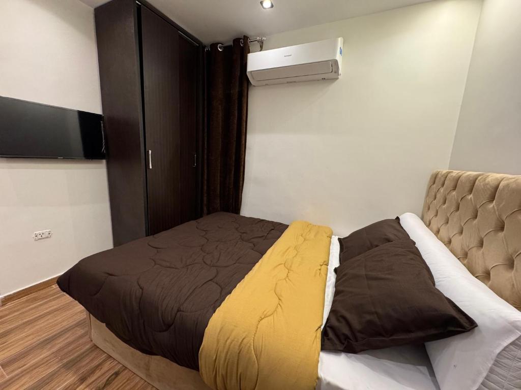 Postel nebo postele na pokoji v ubytování New White Pyramids Inn