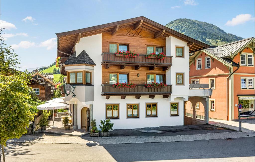 a house in the middle of a street at Schoene Ferienwohnung in Kirchberg in Tirol