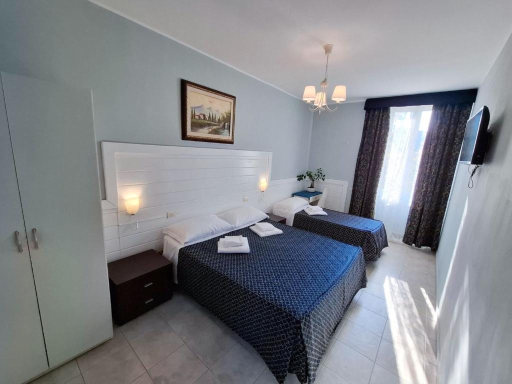 Postel nebo postele na pokoji v ubytování Hotel Aurelia Milano Centrale