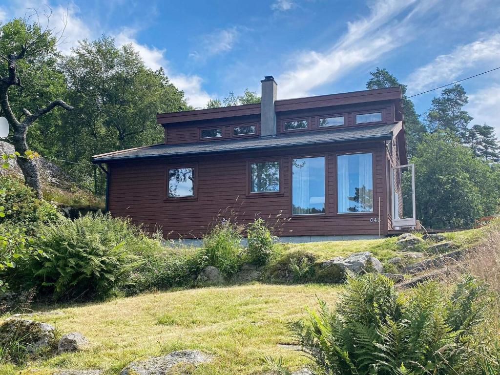 una casa in cima a una collina di 7 person holiday home in lyngdal a Lyngdal