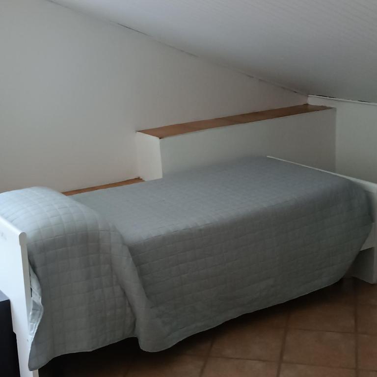 Postel nebo postele na pokoji v ubytování Cascina Flino