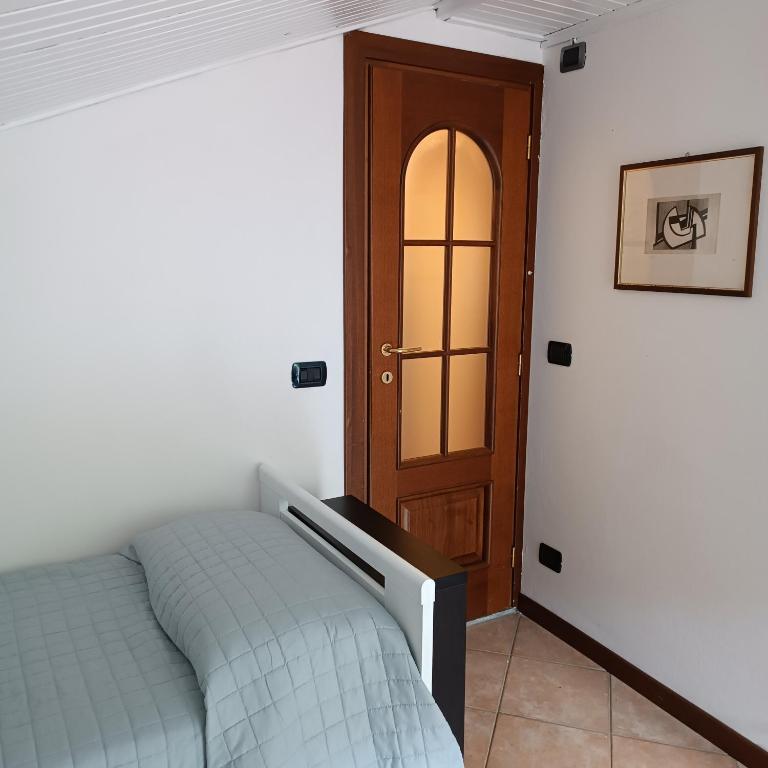 Postel nebo postele na pokoji v ubytování Cascina Flino