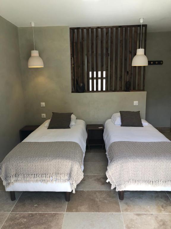 Postel nebo postele na pokoji v ubytování La maison Buis