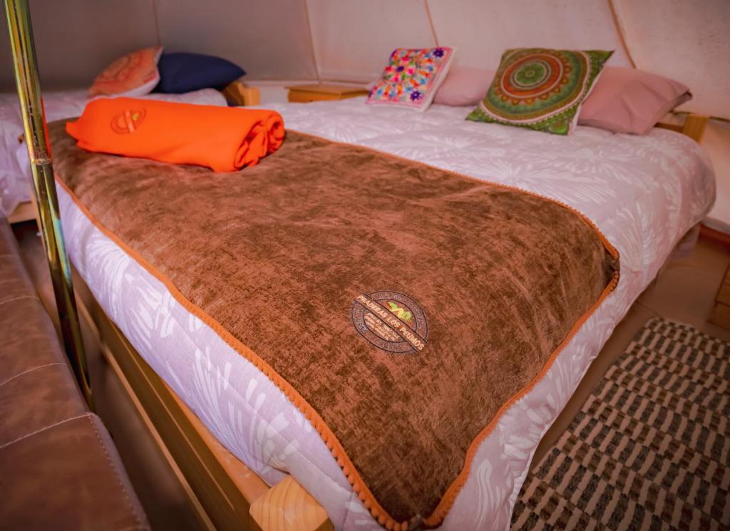 Postel nebo postele na pokoji v ubytování Praderas Los Peumos Glamping-Cabañas