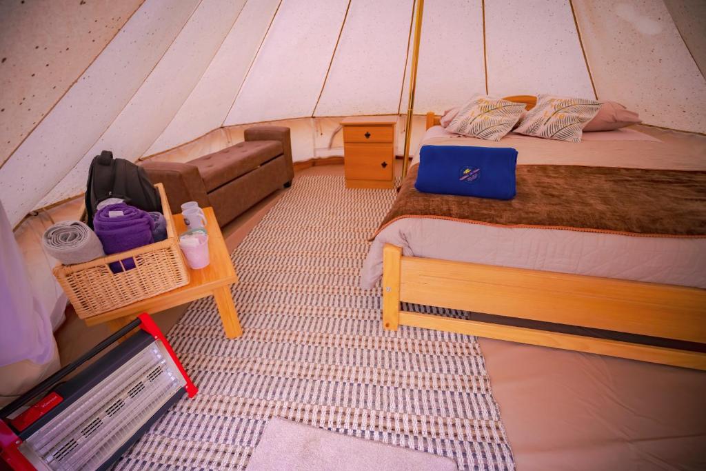 Postel nebo postele na pokoji v ubytování Praderas Los Peumos Glamping-Cabañas