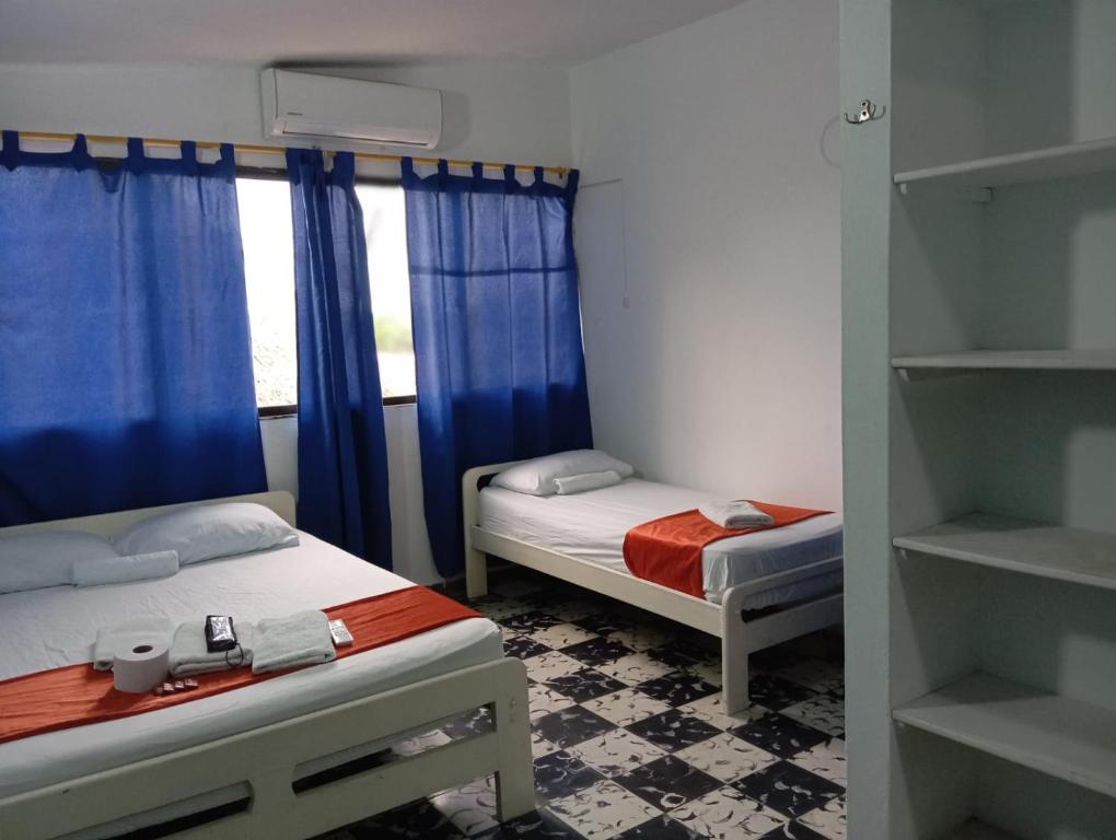 Postel nebo postele na pokoji v ubytování Hotel Palma Azul Coveñas