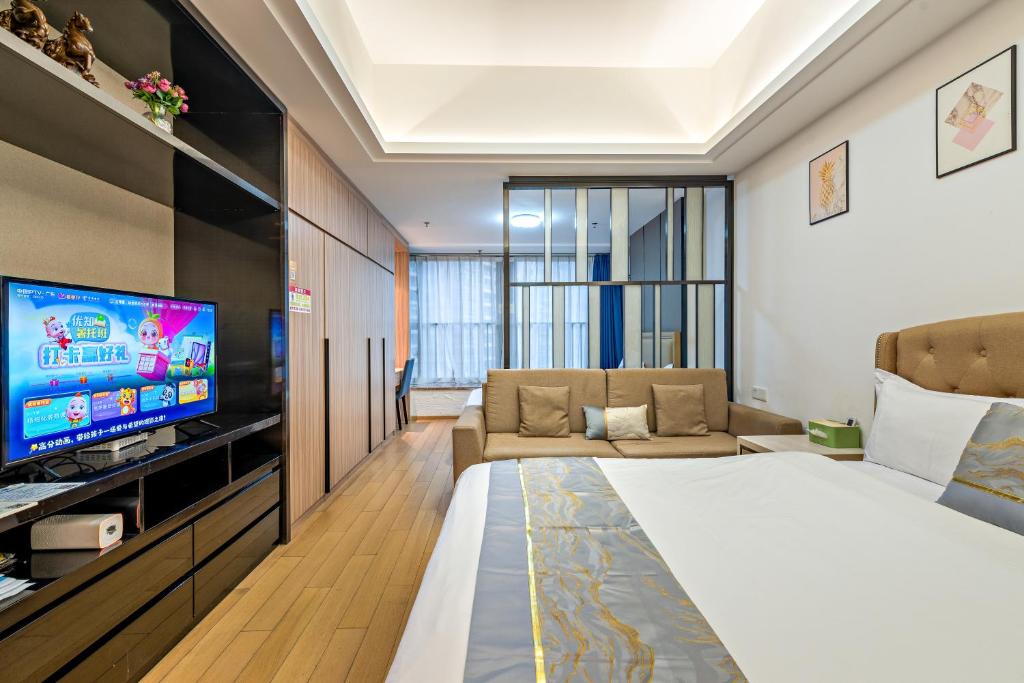 TV a/nebo společenská místnost v ubytování Hantao AI Select International Apartment