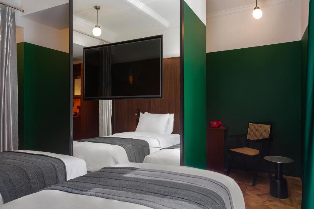 Postel nebo postele na pokoji v ubytování Hotel Afisha