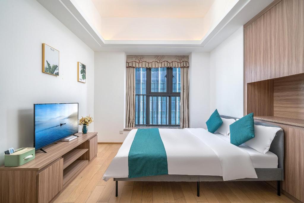 TV a/nebo společenská místnost v ubytování Hantao AI Select International Apartment