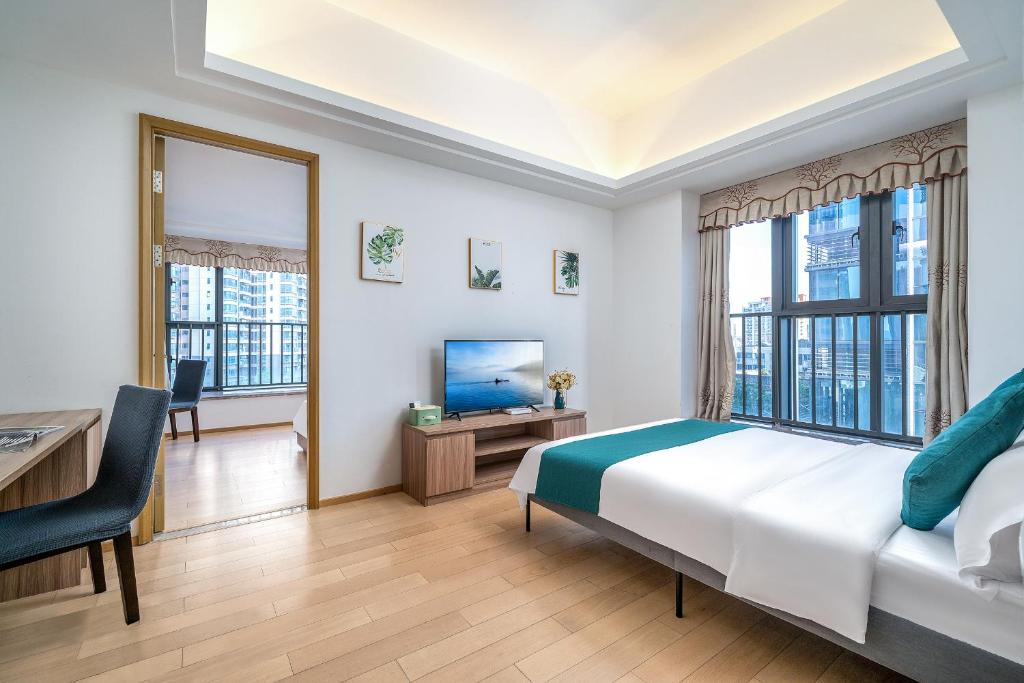 Postel nebo postele na pokoji v ubytování Hantao AI Select International Apartment