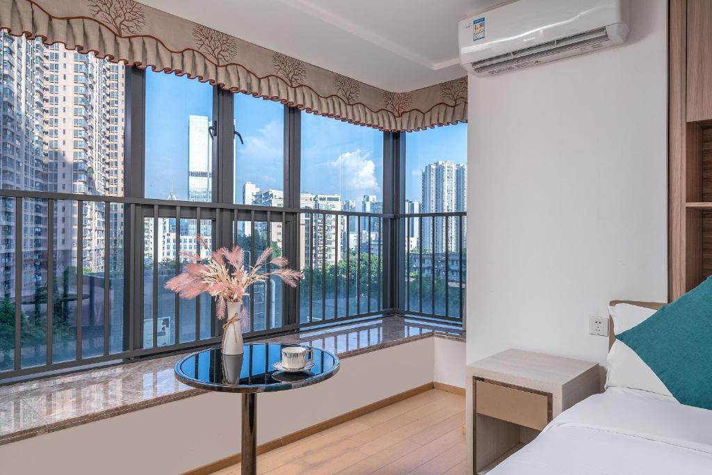 Postel nebo postele na pokoji v ubytování Hantao AI Select International Apartment