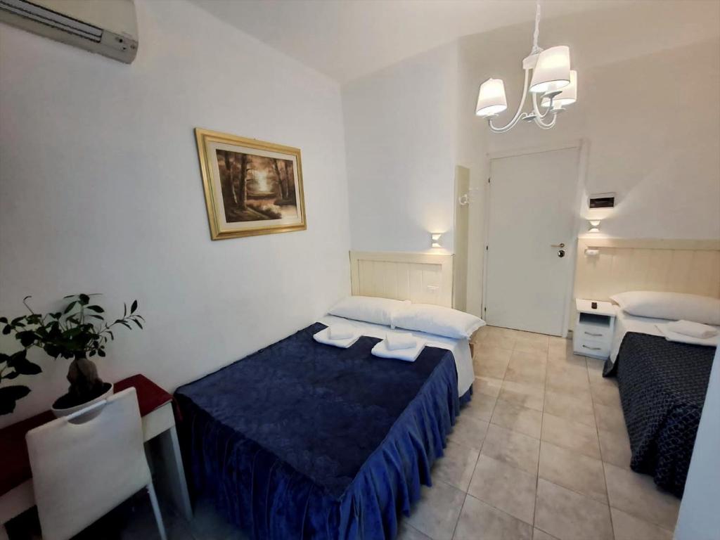 Postel nebo postele na pokoji v ubytování Hotel Aurelia Milano Centrale