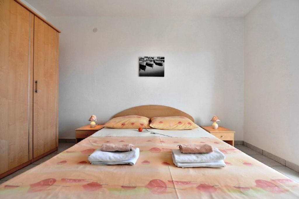 Postel nebo postele na pokoji v ubytování Apartments Nikola