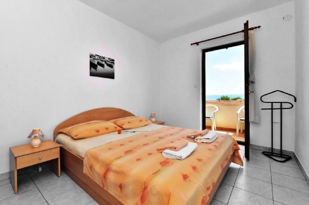 Postel nebo postele na pokoji v ubytování Apartments Nikola